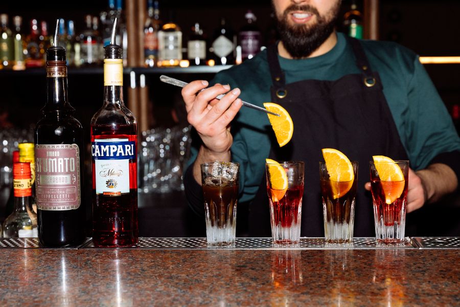 Serving drinks at Studio Amaro