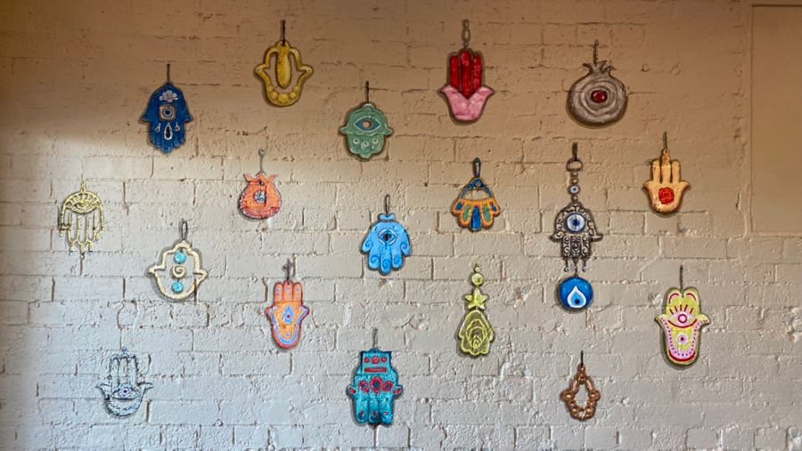 Hand symbols and amulets in The Hamsa Room