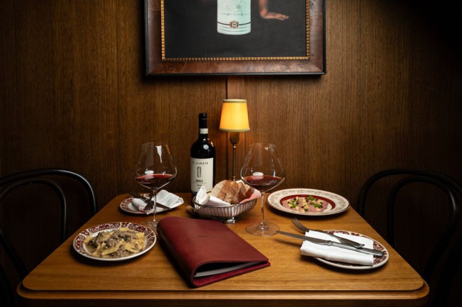 A table with dishes and wine at Bar Olo