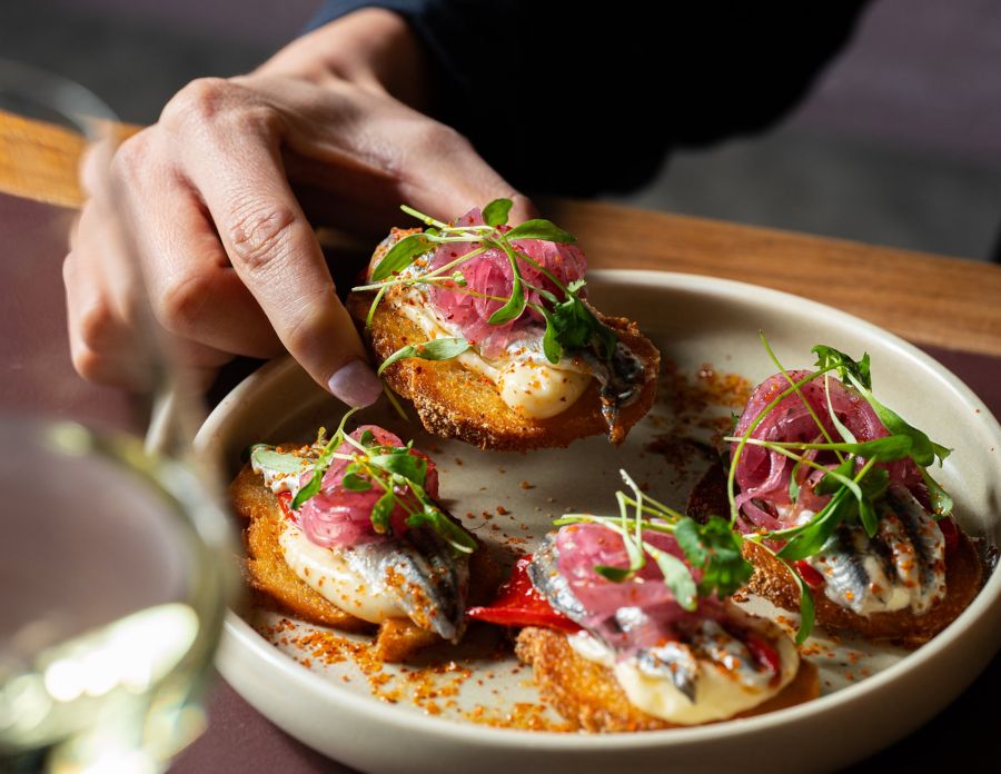 The white anchovy toasts are a salty starter at Bar Sopra