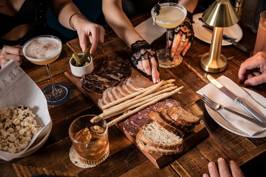 A platter of cured meats with cocktails at Bar 1880 