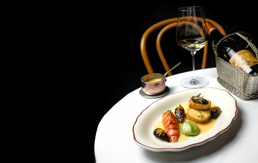 A table of food and wine at Monopole in Sydney