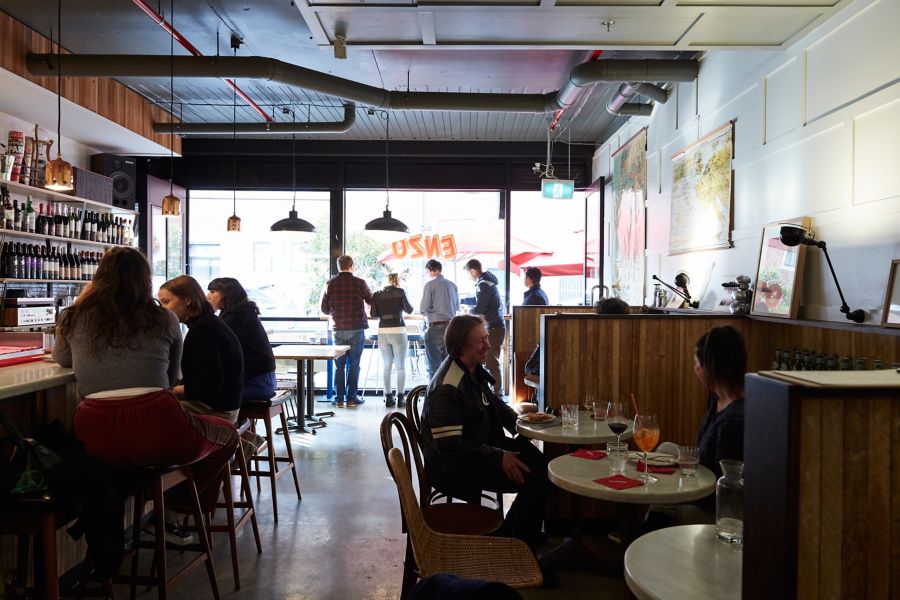 People standing and sitting at Sig Enzo