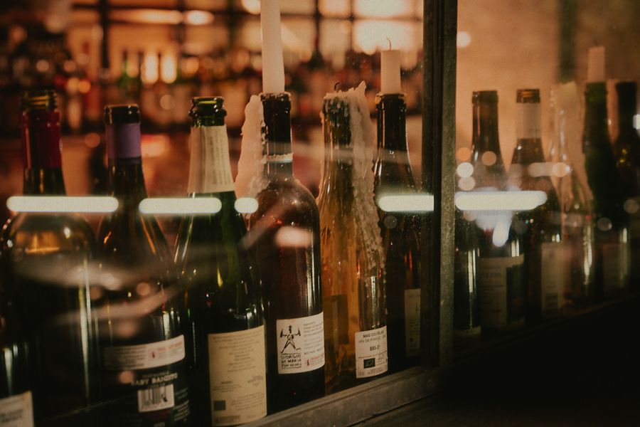 Empty bottles of wine used as candle holders at Bessie's and Alma's 