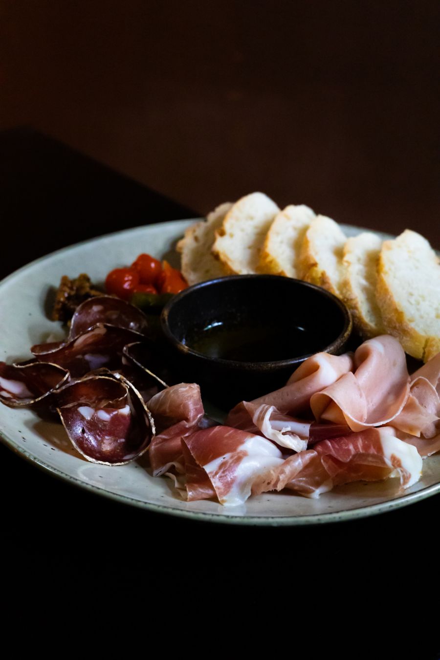 Spanish-style jamon and other charcuterie on a platter at Before + After