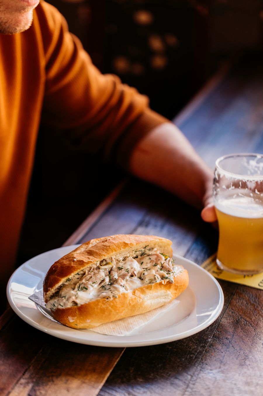Closeup view of man enjoying food and drinks at The Old Fitz