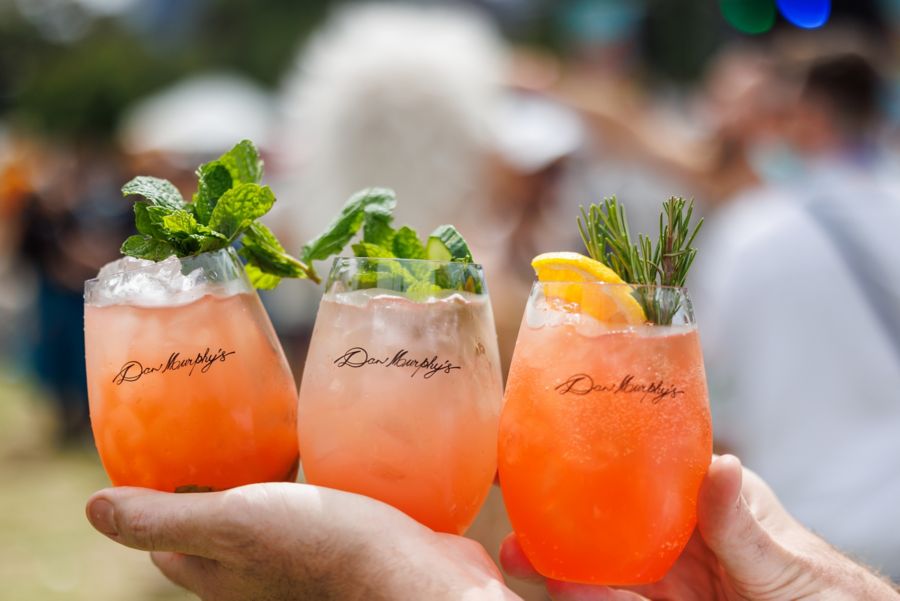 Holding three cocktails in Dan Murphy's glasses 