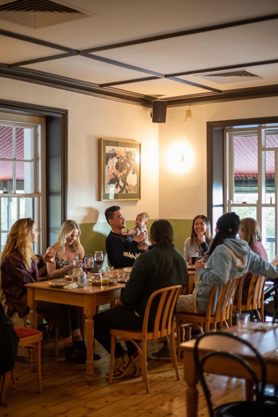 People enjoying food and  cocktail at The Scenic Hotel