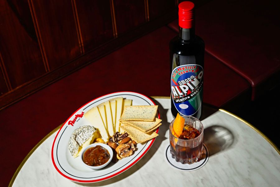 Distilleria Alpina Amaro Alpino Along with Potato Roll, Mustard Pickles, Parmesan, and Crinkle-Cut Crisps.