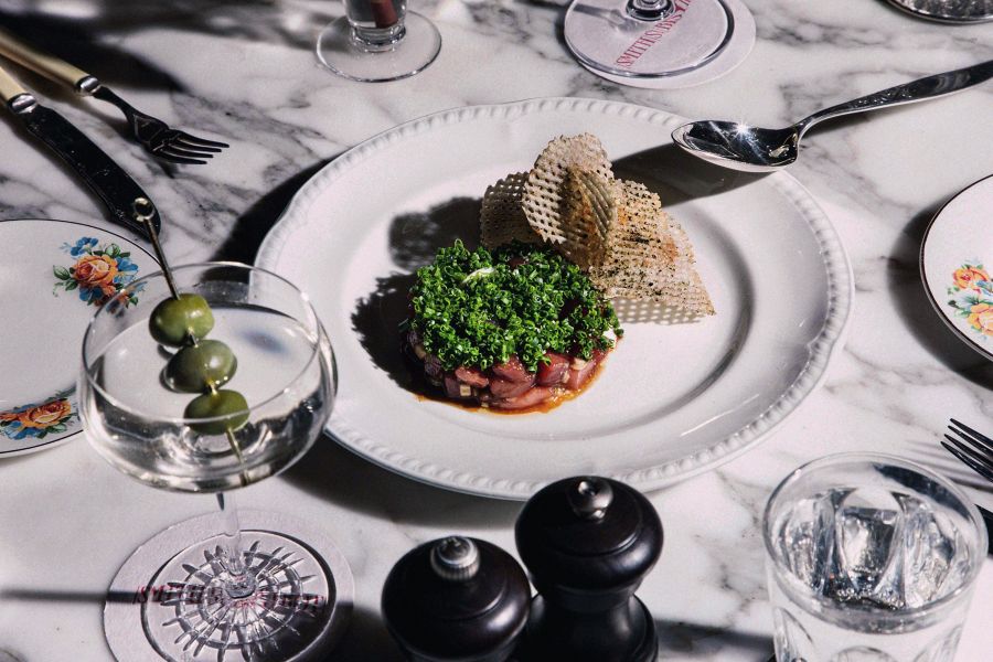 people talking at a bar