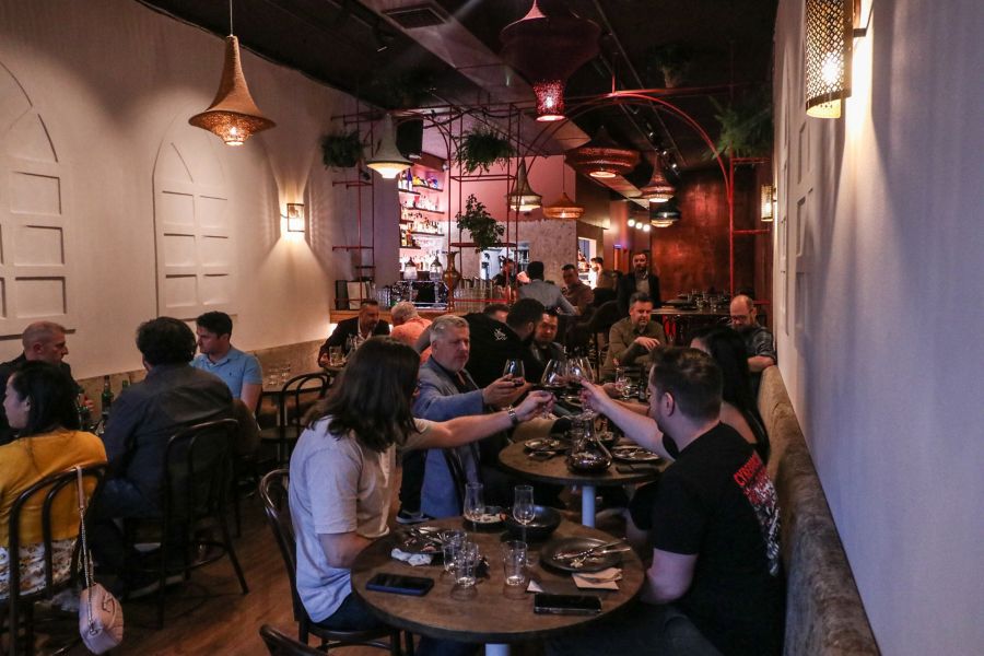 A busy scene inside Bar Beirut in Canberra