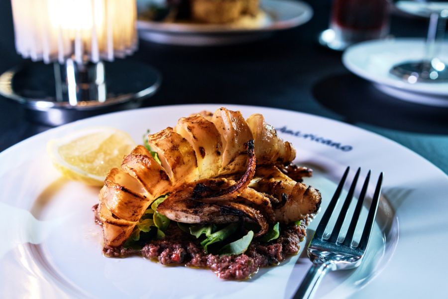 Food and cocktail served at Grill Americano