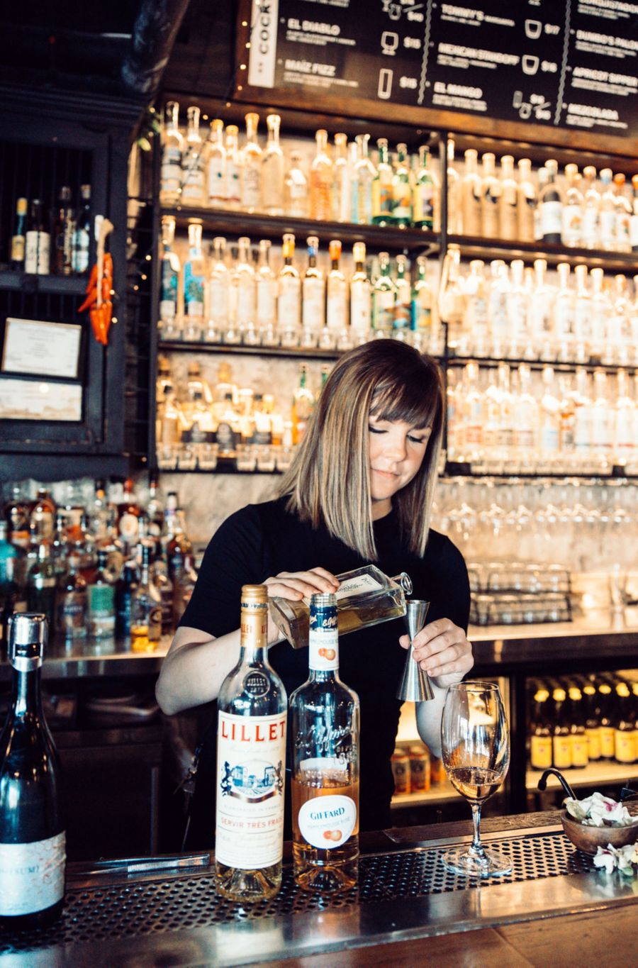 Bartender making a cocktail at El Gratto bar