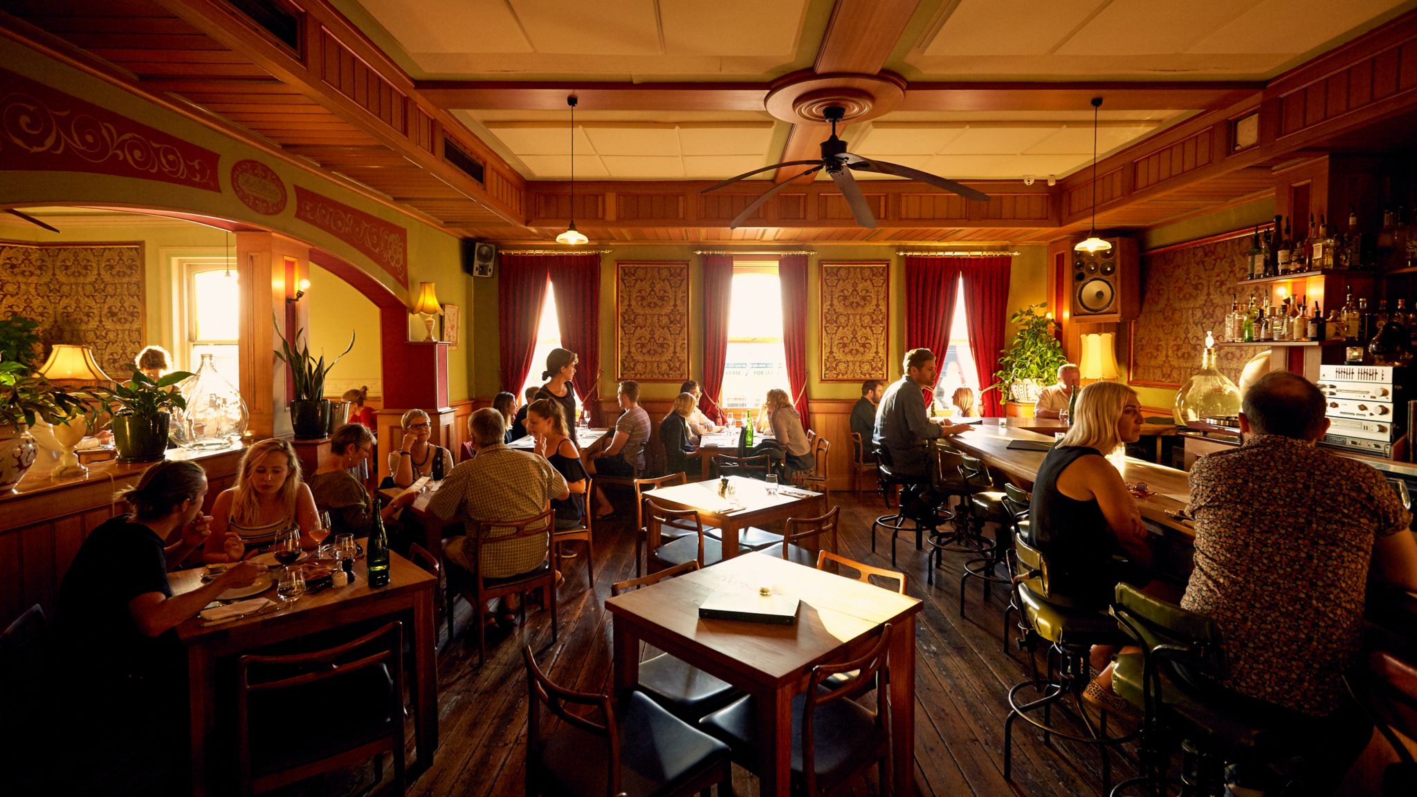 view of a restaurant where people enjoying their meal and having conversation