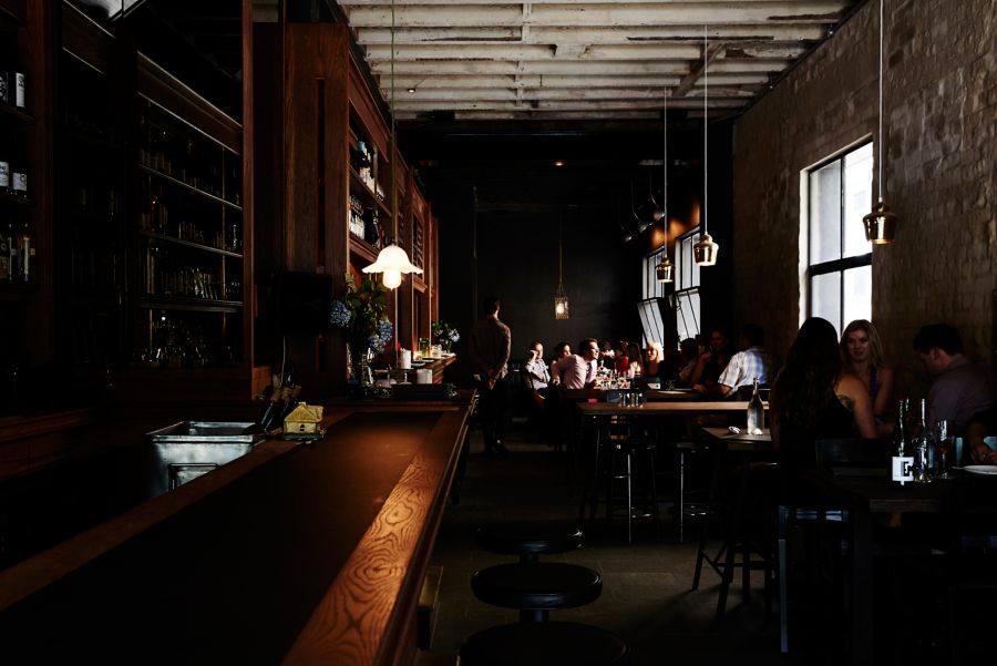 peoplehave discussion around something on a restaurant