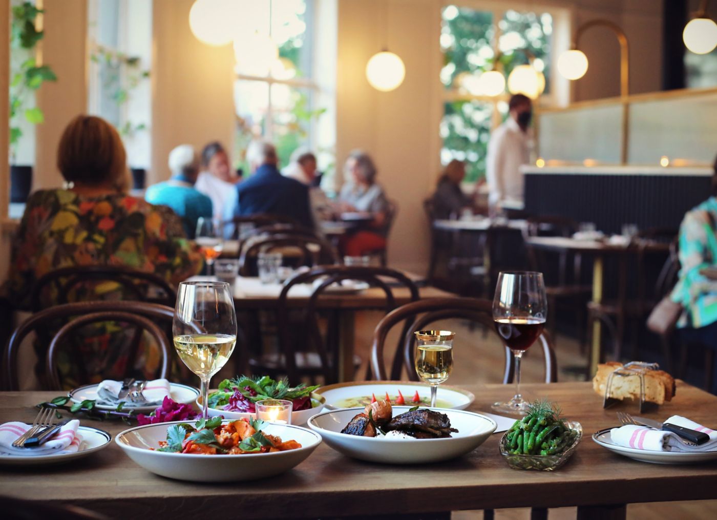Wine and dishes inside Maeve in Brisbane