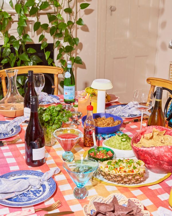 Mexican fiesta dinner table set up with wine