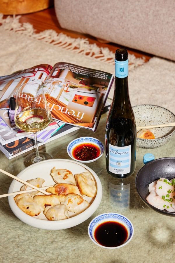 Wittman Riesling and dumplings on coffee table with sauce