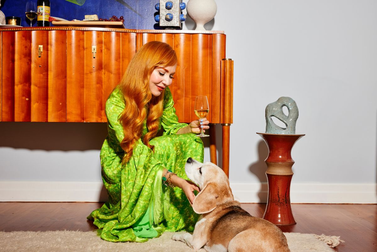 Kelly Thompson patting her dog Billie