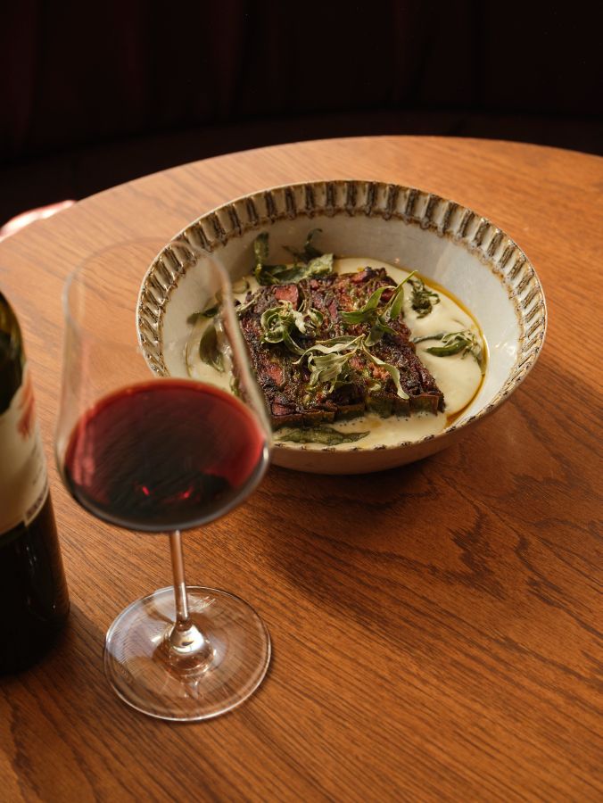 A glass of red wine with the duck lasagne at Lagotto in Melbourne