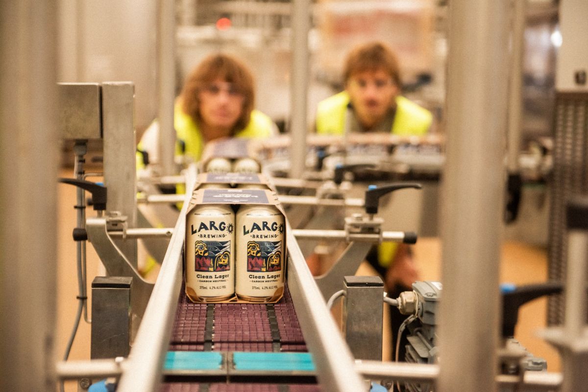 Oli and Louis watching LARGO cans go down production line in brewery