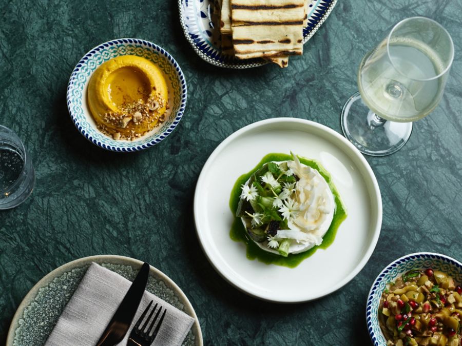 Dishes and a glass of wine at Maydanoz, Sydney