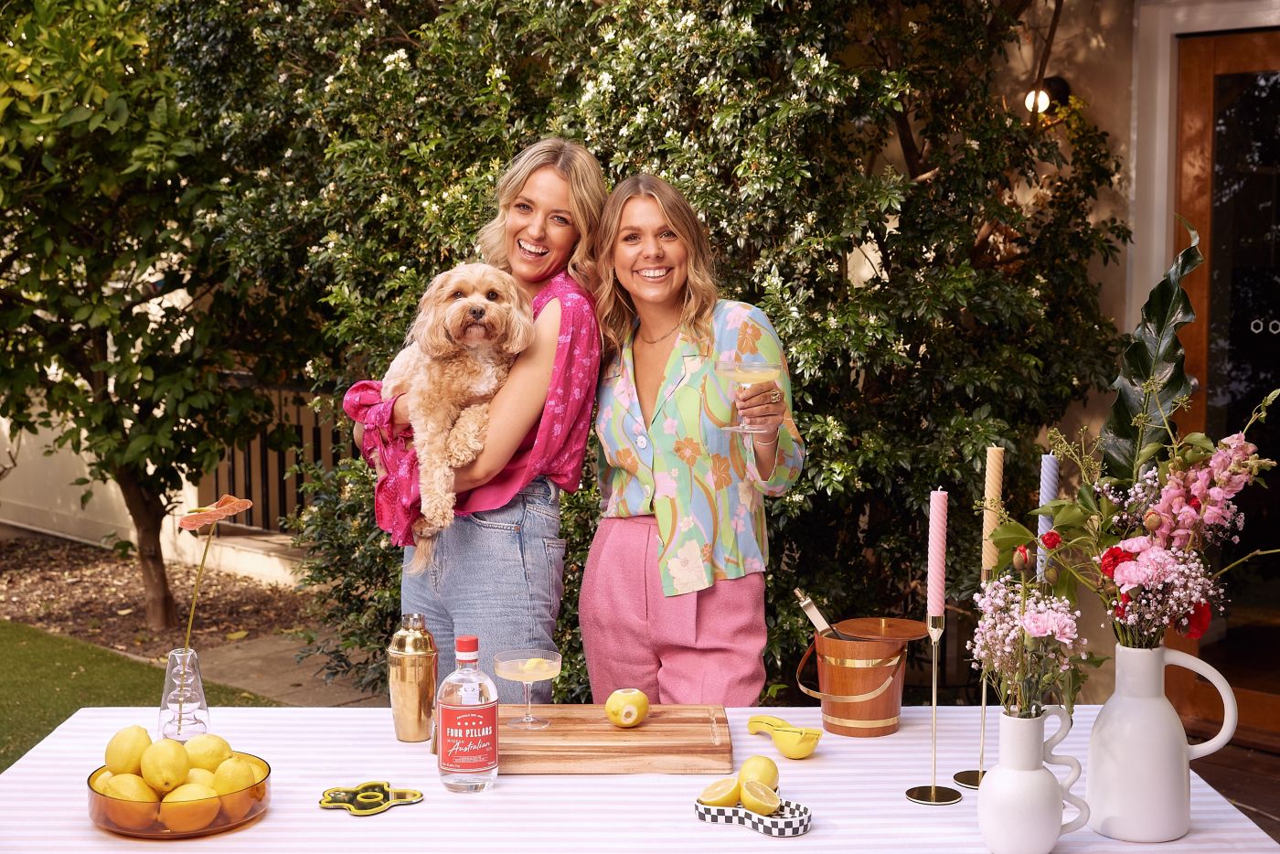 The duo from the Shameless podcast with the Bee's Knees cocktail  