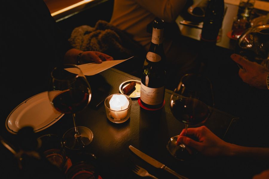 A table with wine at Attenzione in Redfern