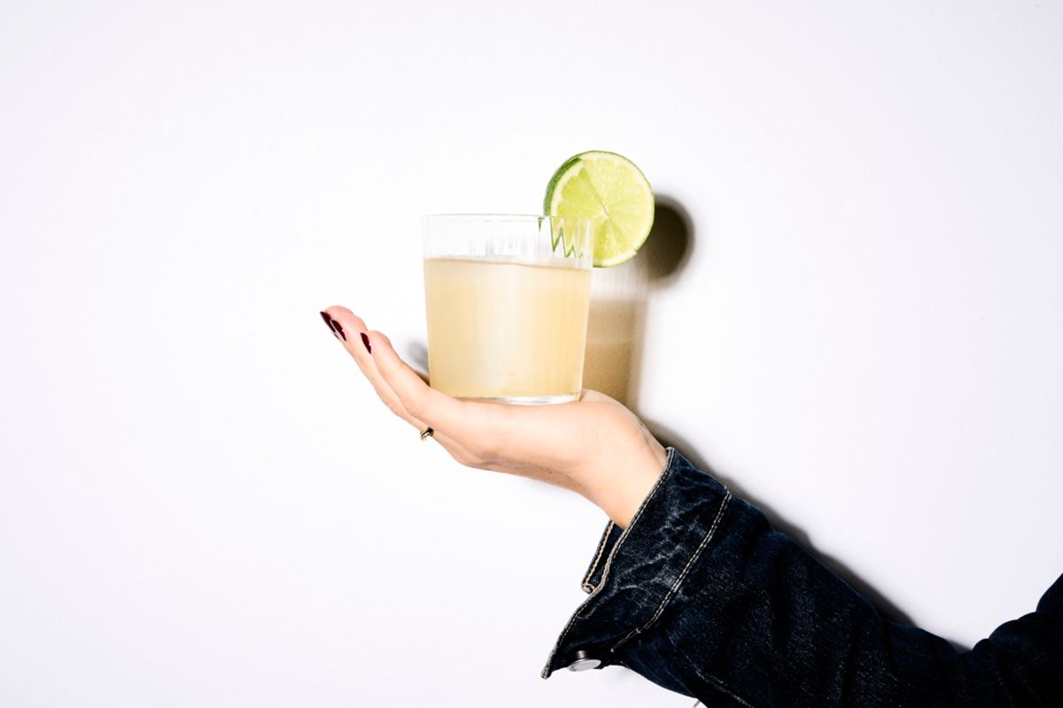 Holding a Tommy's Margarita against a white background