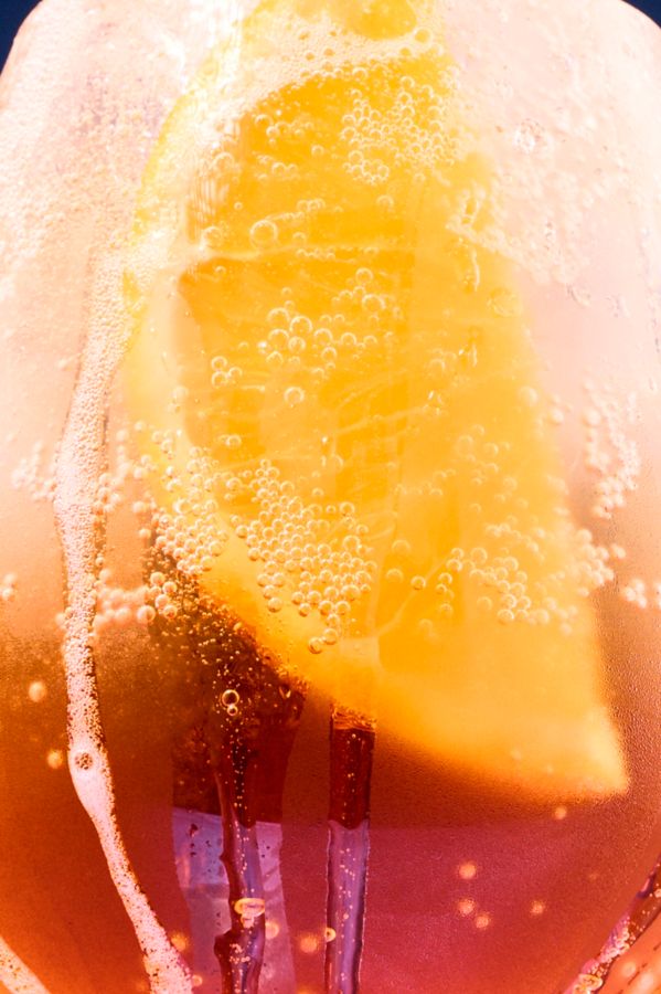 Looking into a wine glass holding an Aperol Spritz