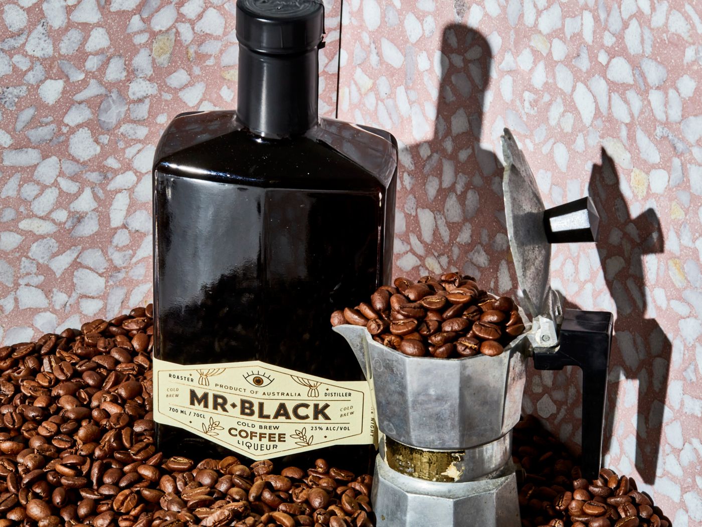 A bottle of Mr Black coffee liqueur with coffee beans