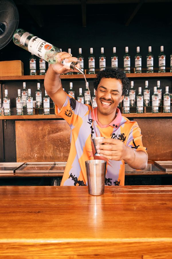 Pouring bacardi rum into cocktail jigger