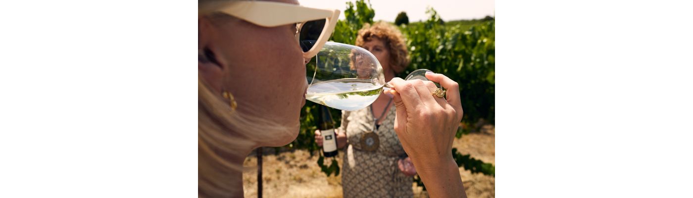 Sipping a glass of wine among the vines in the Adelaide Hills