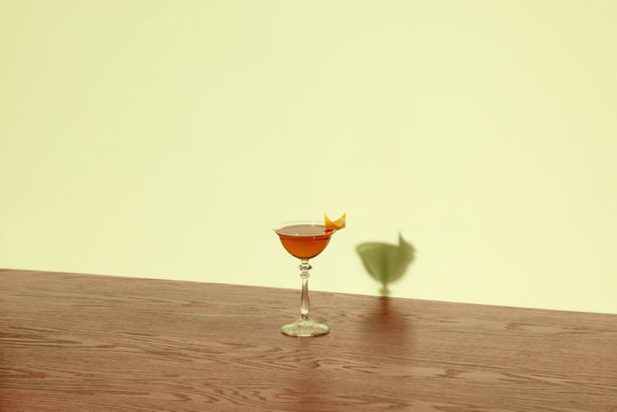 The Tipperary cocktail against a yellow background