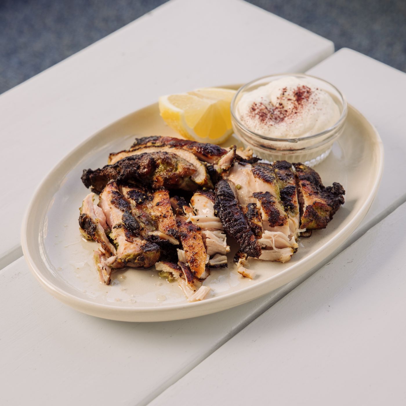 The popular yoghurt and herb marinated chicken at Yamas Greece in Melbourne