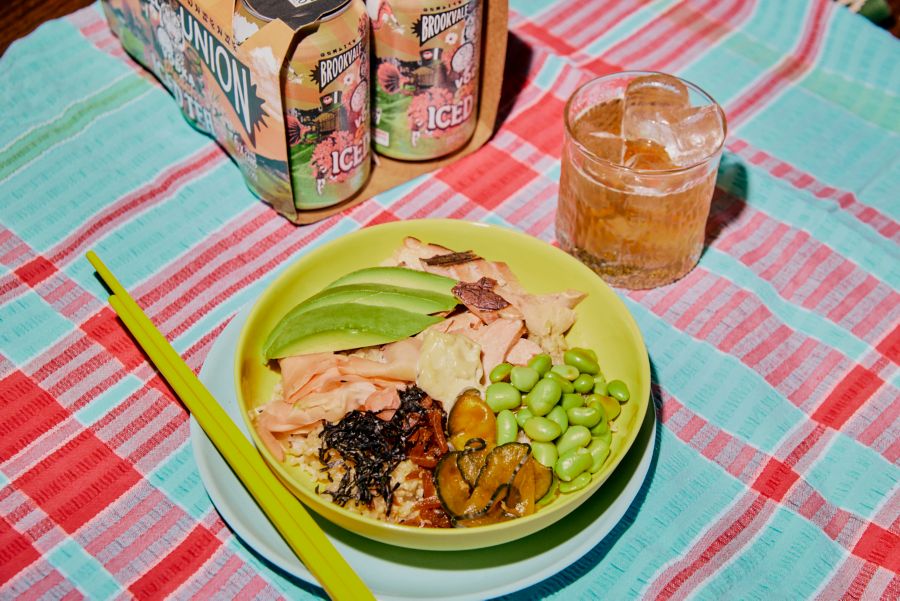 A poke bowl with salmon and avocado paired with Brookvale Union Peach Iced Tea 