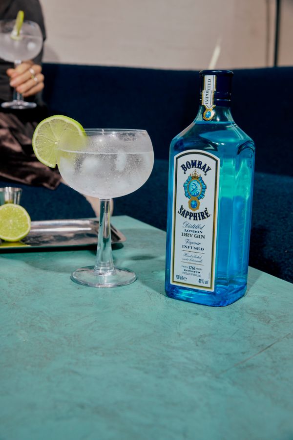 A bottle of Bombay Sapphire and a G&T