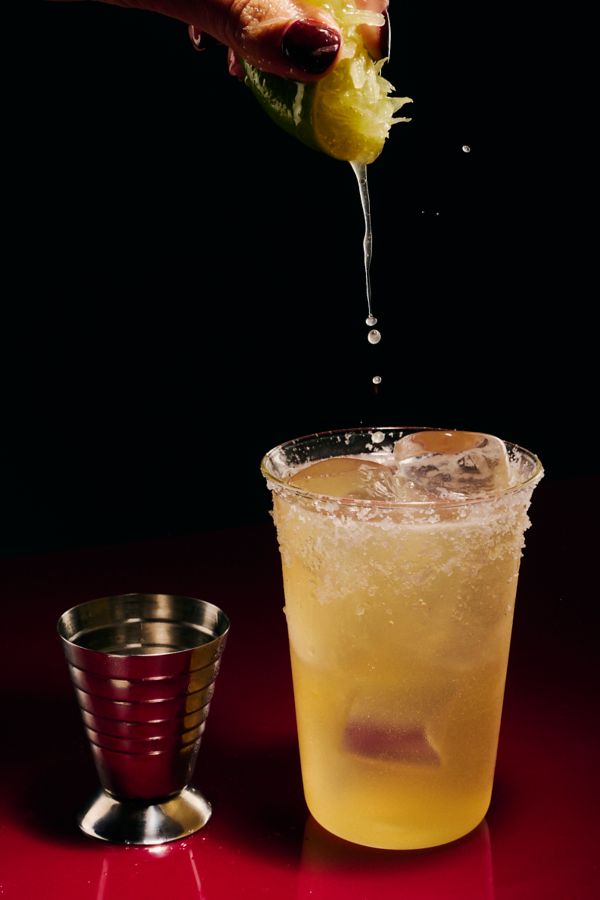 Squeezing lime into the Apple Cider Margarita