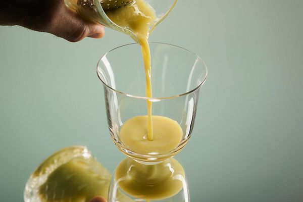 Pouring the Baklava Old Fashioned into a glass