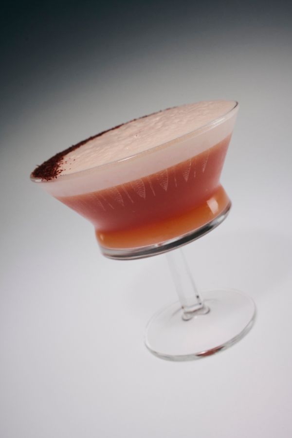 The Blood Orange Amaretto Sour is garnished with sumac