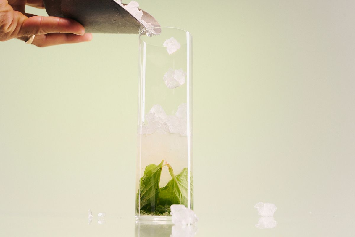 Adding ice to a Ginger Rogers cocktail 