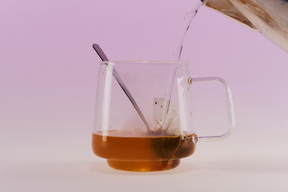 Pouring the warm Hot Toddy Slam into a mug
