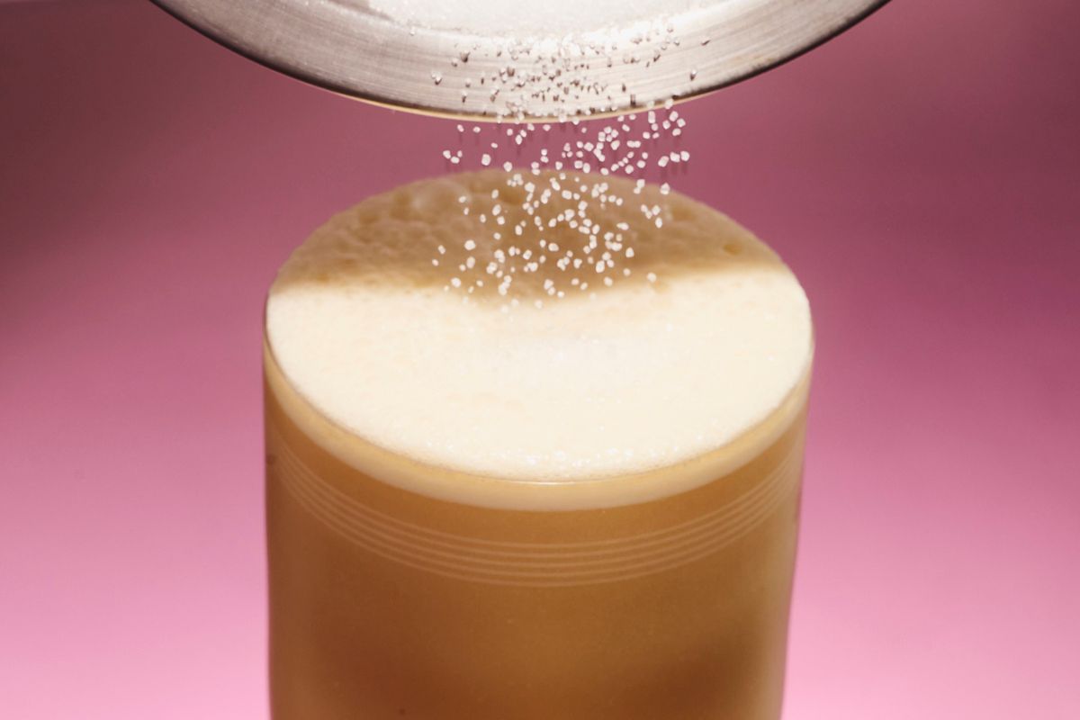Finishing the Miso Maple Whiskey Sour with sugar on top