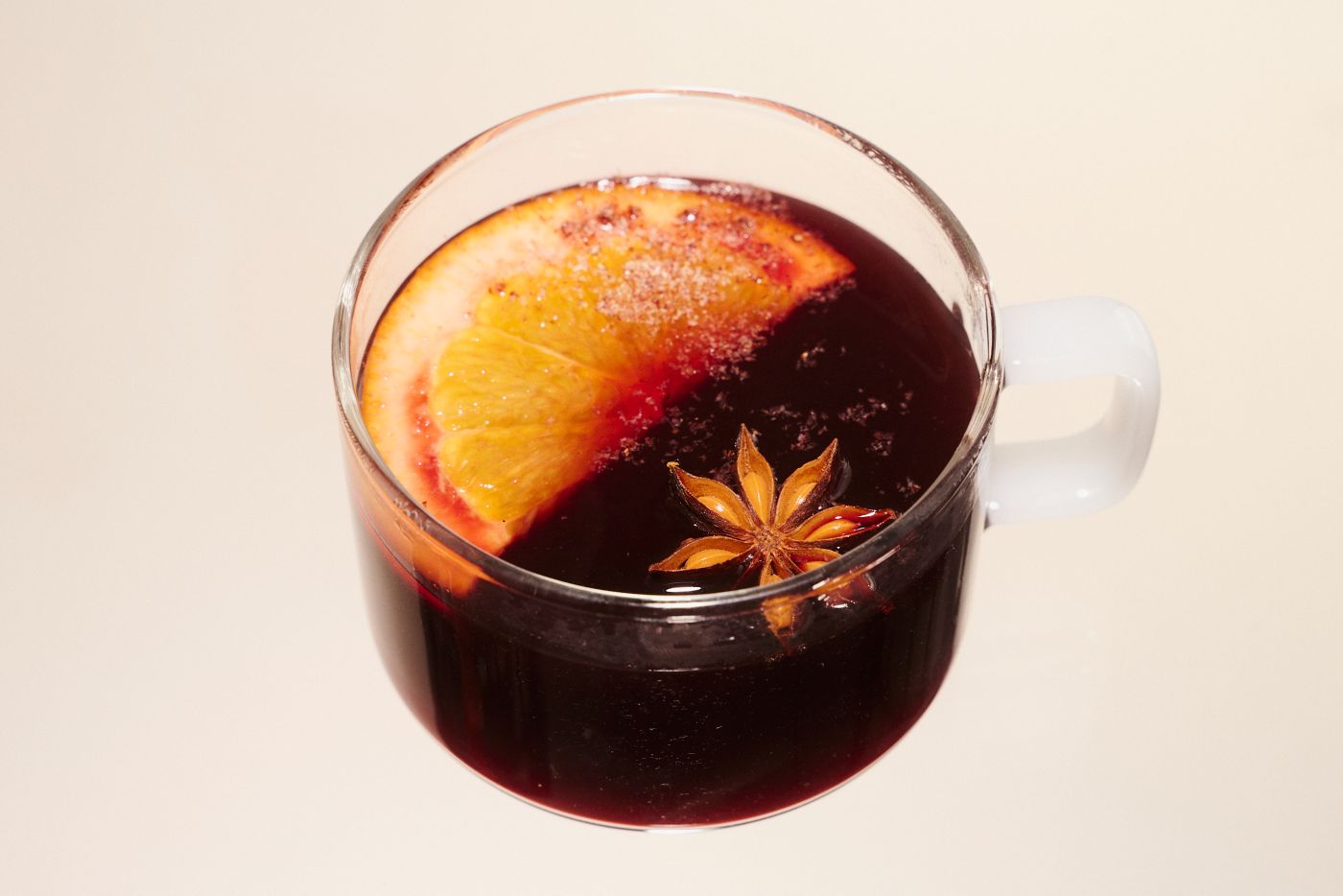 Mulled Wine in a glass mug with star anise and citrus