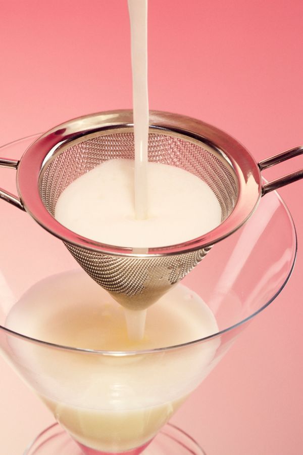 Straining the Non-Alcoholic Sour into a glass  