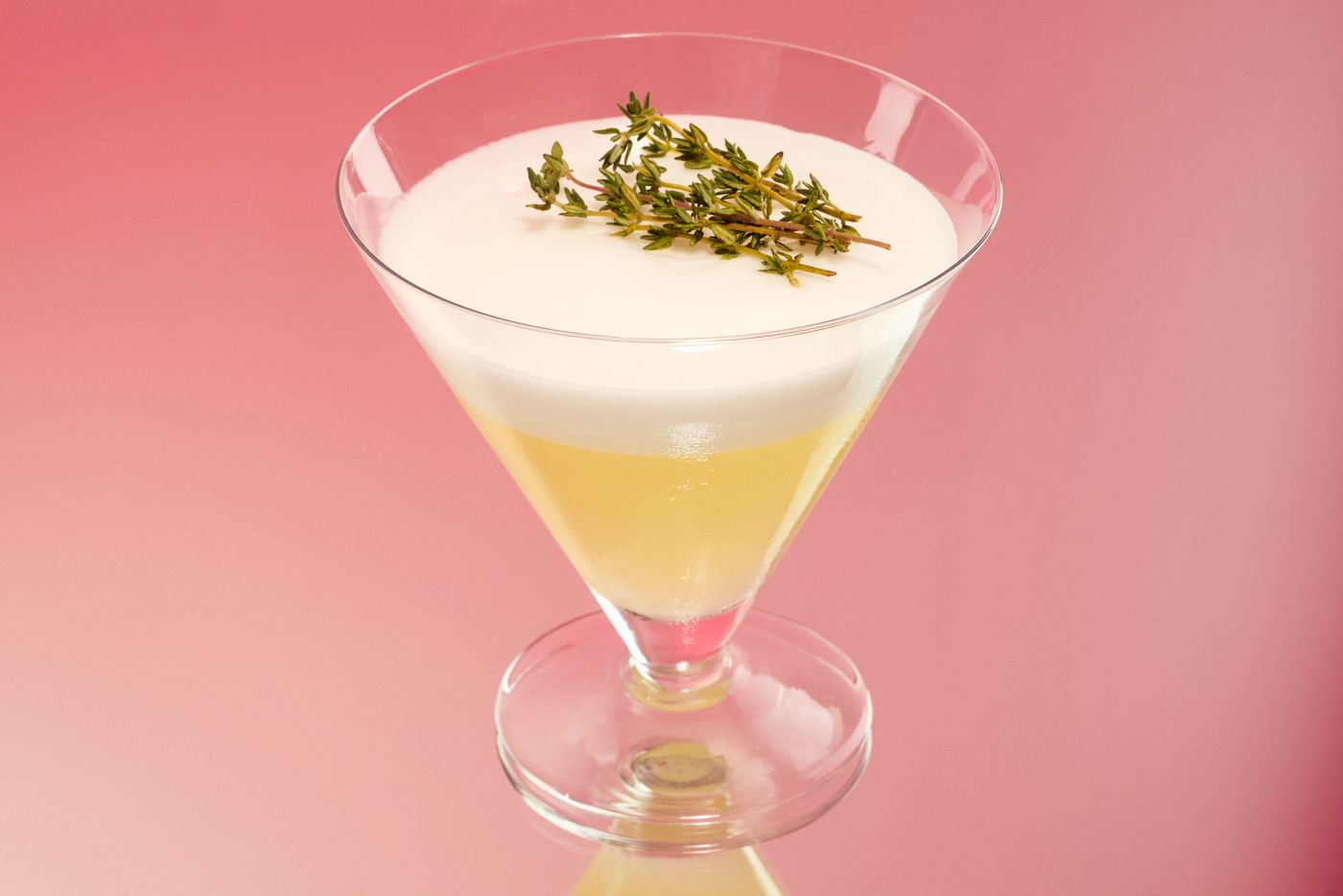 The Non-Alcoholic Sour is garnished with fresh thyme