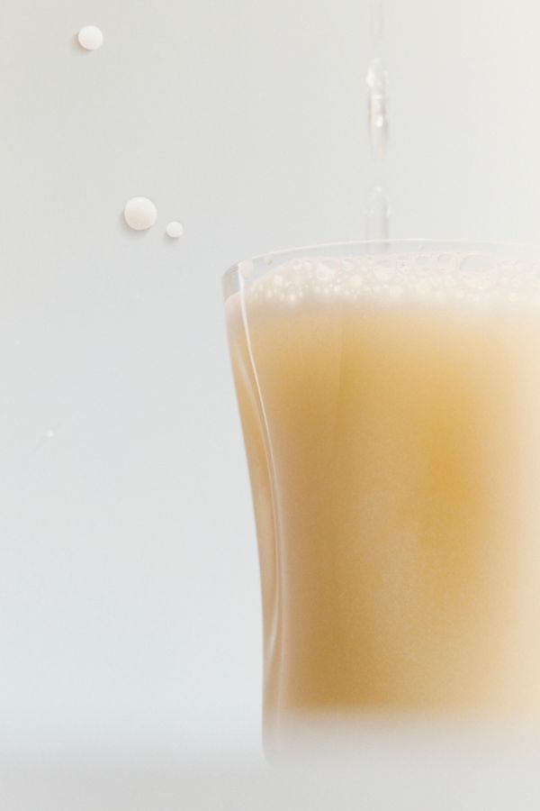 Pouring a Yoghurt Soju Highball into the glass