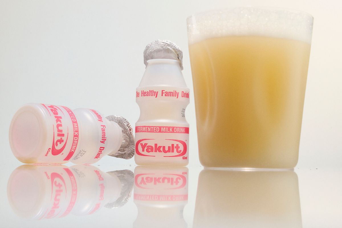 The Yoghurt Soju Highball with bottles of Yakult