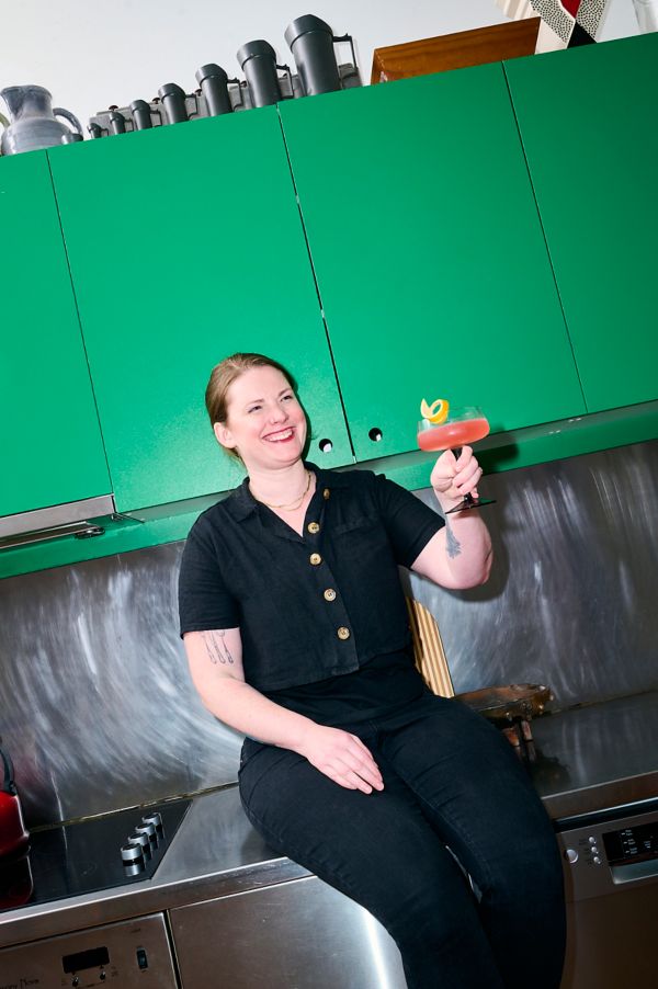 Cara Devine holding the tequila-based Siesta cocktail