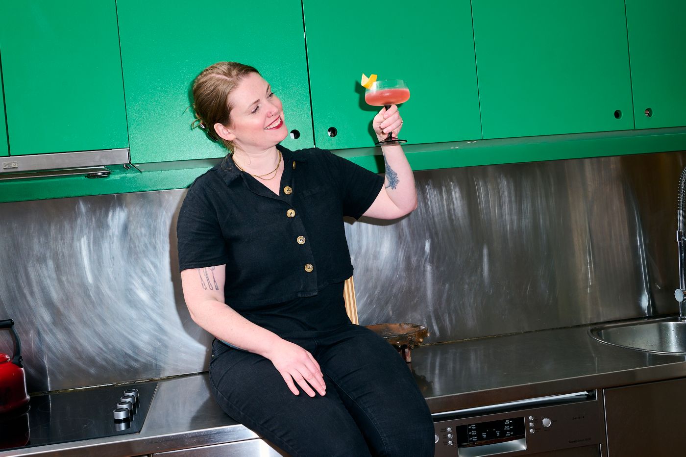 Cara Devine holding her cocktail creation, Siesta